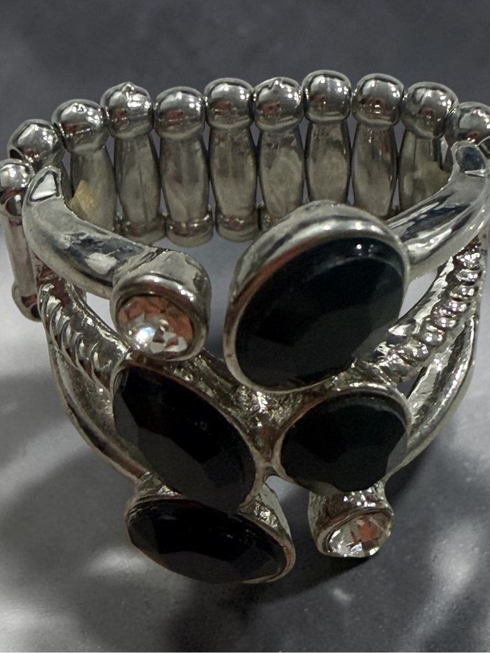 Elegant Silver-Tone Ring with Black Gemstones